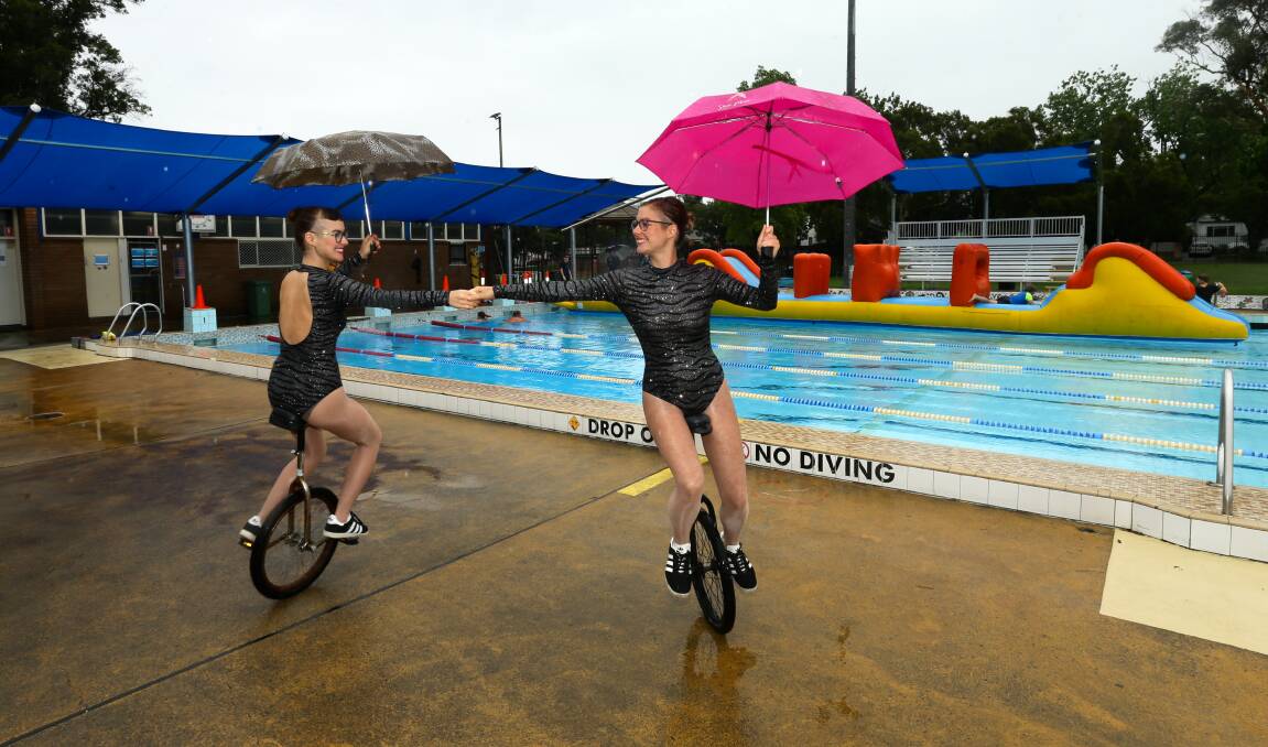 UNDER WATER: Performers Claudia and Alessandra at an almost deserted Mayfield pool party on Friday. Picture: Jonathan Carroll