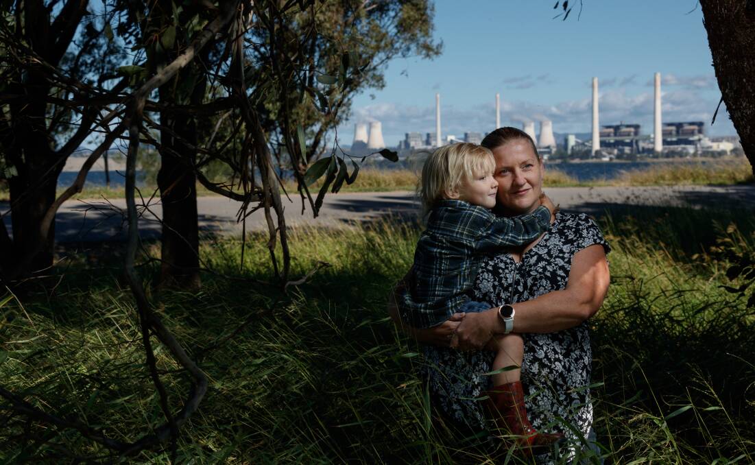 CHANGE COMING: Amanda Morris and son Tully in front of the Bayswater and Liddell power stations near their property at Hebden, outside Muswellbrook. Picture: Max Mason-Hubers