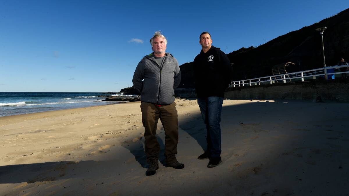 South Newcastle surfers Mick Wilson, left, and Bernie Wilson at the beach on Sunday. Picture: Jonathan Carroll