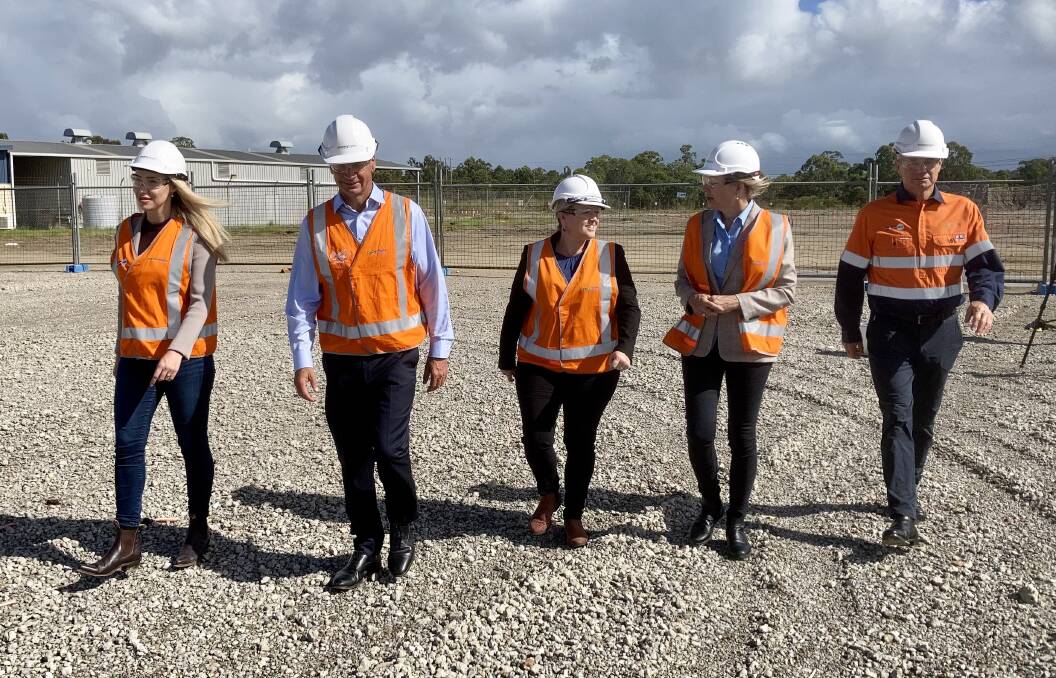 HIGH VISIBILITY: The Lib team steps out with Snowy Hydro chief Paul Broad at Kurri Kurri this week.