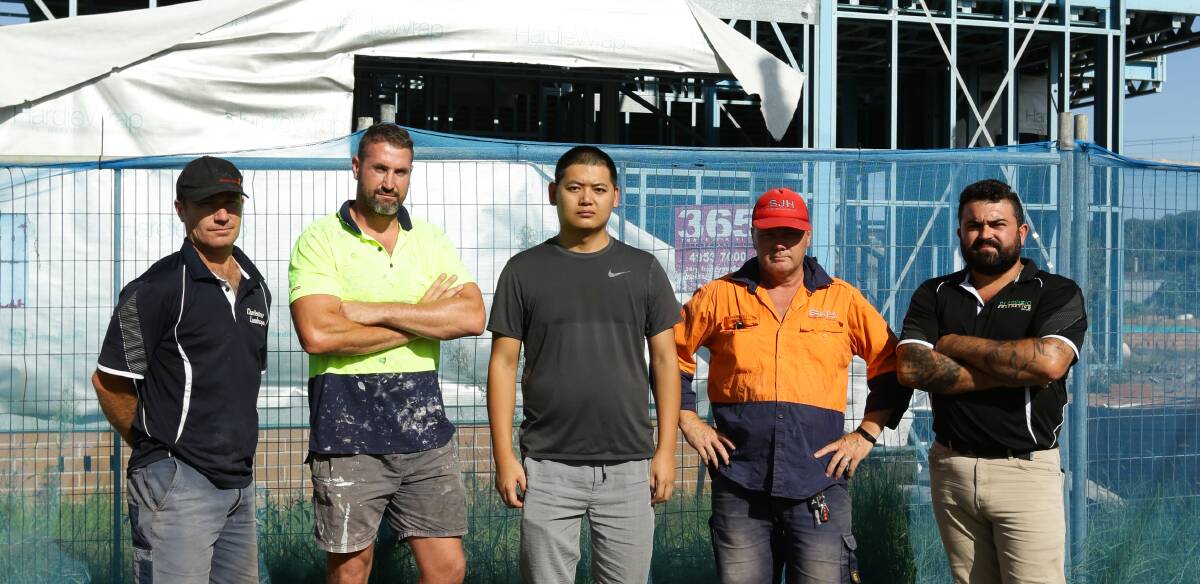 OUT OF POCKET: Newcastle subcontractors David Mansfield, Jake Fuller, Barry Huang, Steve Horton and Vince Di Prinzio are among dozens owed millions of dollars after the collapse of Sehez Group. Picture: Jonathan Carroll