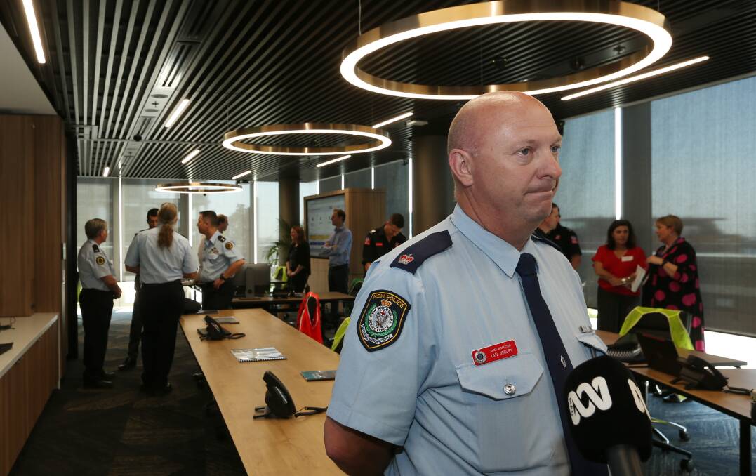 'IMPRESSED': Newcastle City police district chief inspector Ian Macey talks to the media inside the operations centre on Thursday. Pictures: Simone De Peak.