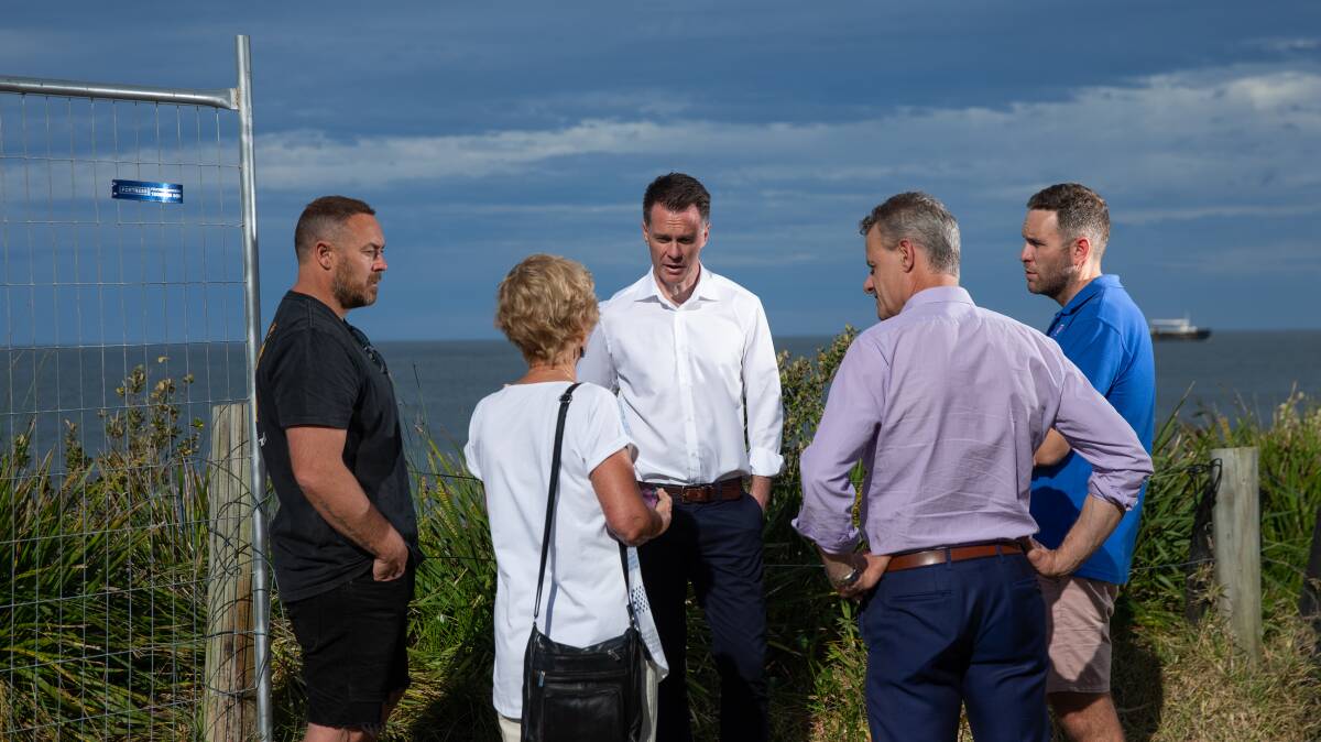 Chris Minns, centre, and Newcastle MP Tim Crakanthorp meet with Lucas Gresham, Barbara Whitcher and Callan Nickerson at Stockton on Monday. Picture by Marina Neil