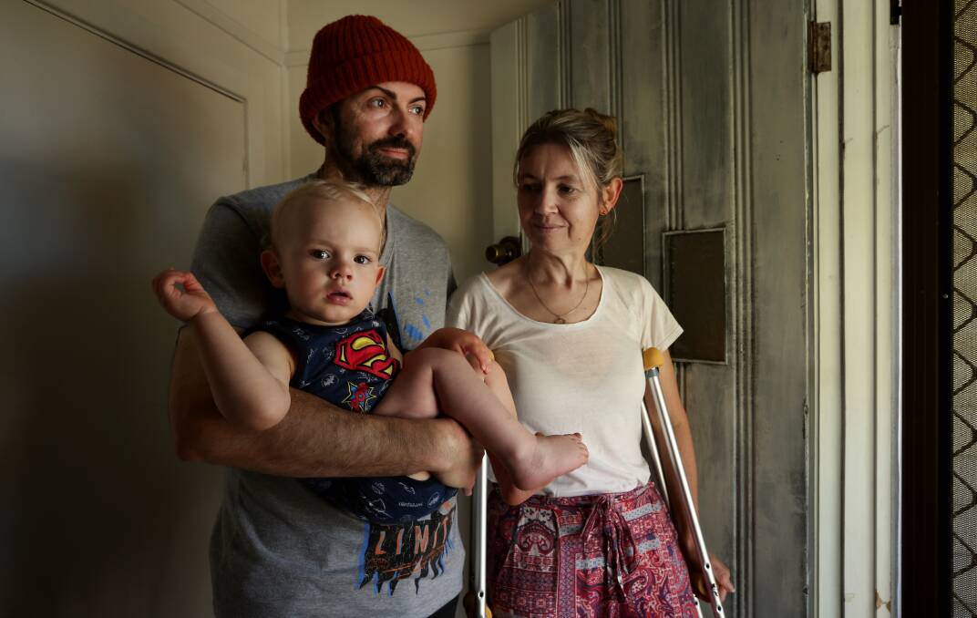 LUCKY ESCAPE: Dave and Bonnie Constable at home in Lambton with 19-month-old son Malachi. Picture: Simone De Peak 