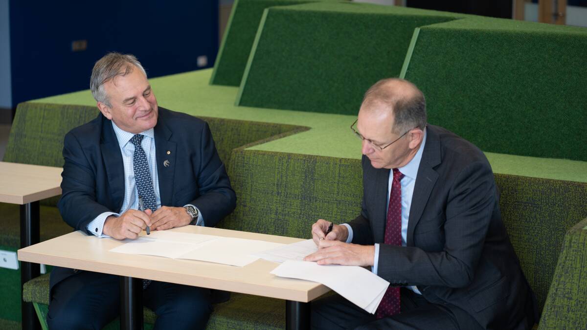 DEAL: Vice-chancellor Professor Alex Zelinsky signs the memorandum of understanding with Port of Newcastle chief executive Craig Carmody at NUspace on Friday. Picture: Supplied