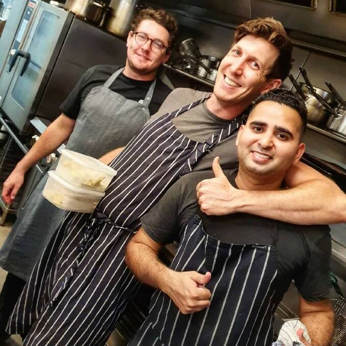 HELPING HAND: Vishal Sharma at the Burwood Inn with head chef Jeremy Salmon and sous chef Kristian Smith. 