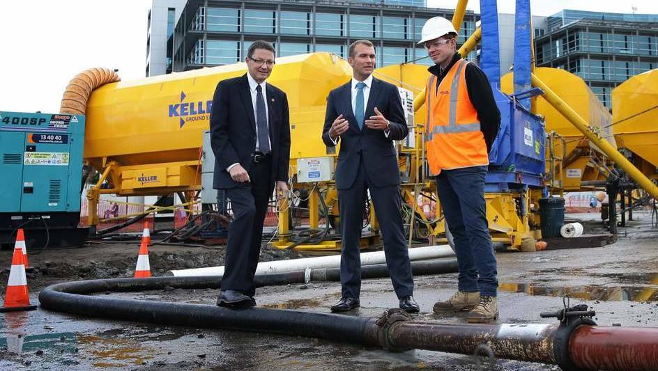 REVIEW: Former Planning Minister Rob Stokes, centre, inspecting state-funded mine grouting at a Honeysuckle redevelopment site in 2015. Picture: Marina Neil