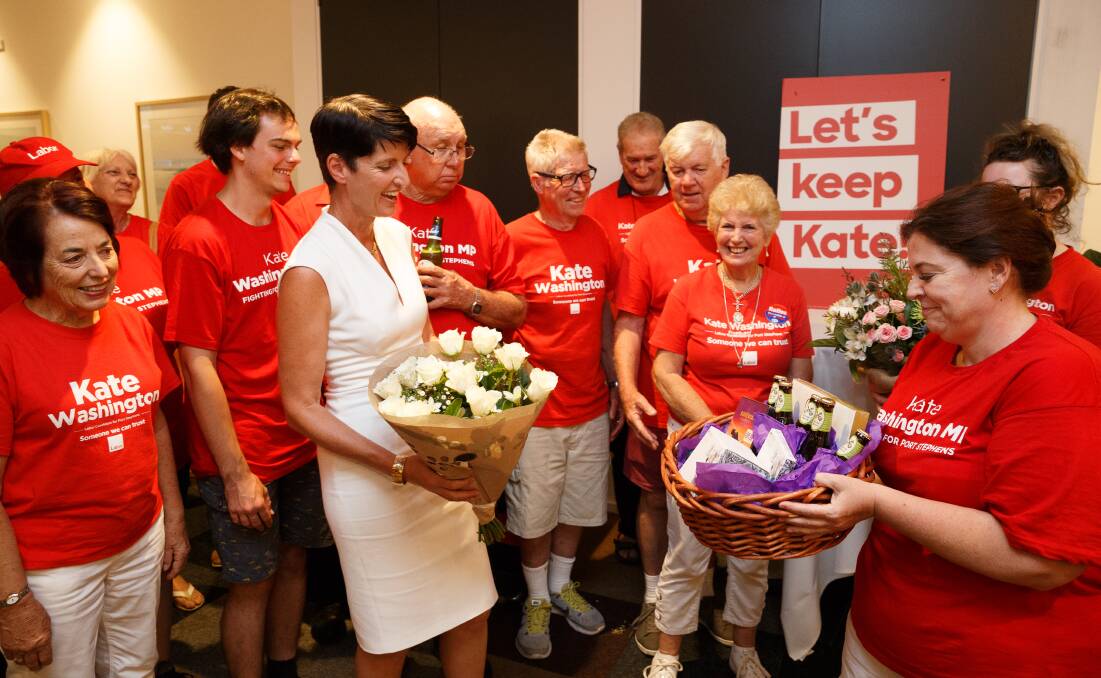 Kate Washington celebrates with her supporters in Medowie on Saturday night. Picture: Max Mason-Hubers
