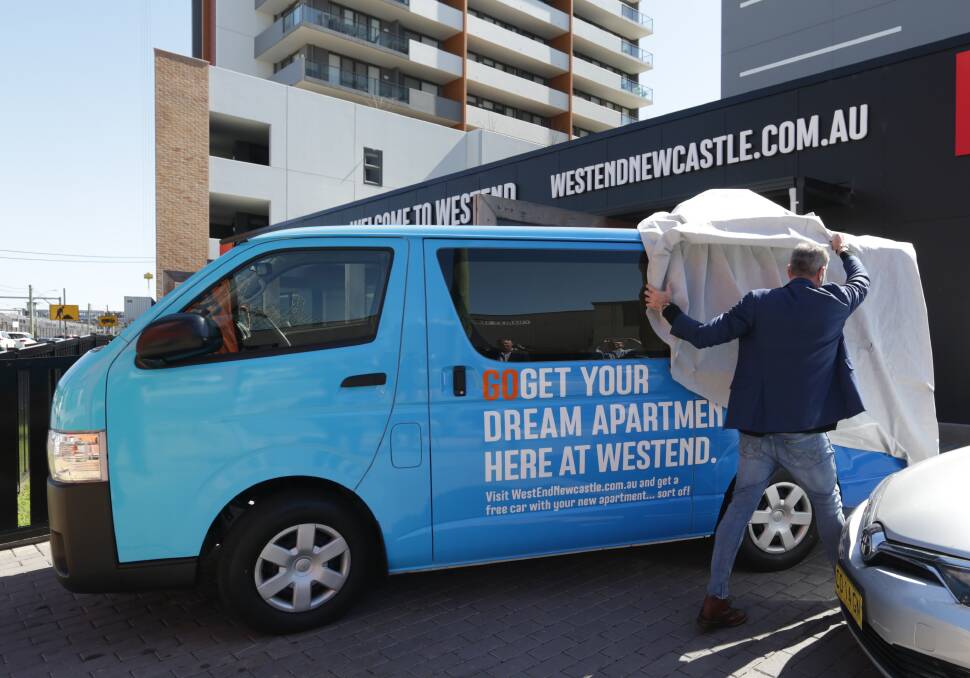 SHARING ECONOMY: Thirdi property group director Luke Berry unveils a GoGet vehicle which will be based at one of the company's apartment buildings in Wickham. 
