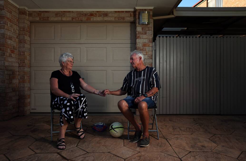 TOUGH TIME: Sue and Peter Wallace outside their Eleebana home on Wednesday. Picture: Simone De Peak