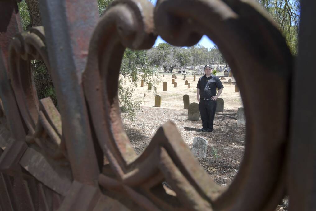 HISTORY: Golden Dragon Museum researcher Leigh McKinnon among the graves in Chinese section of White Hills Cemetery. Picture: NONI HYETT