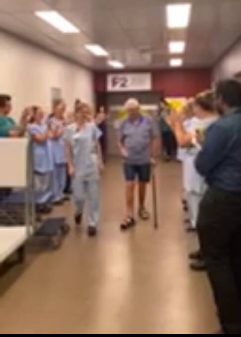 Ron Mansfield is clapped out of the designated COVID ward at John Hunter Hospital