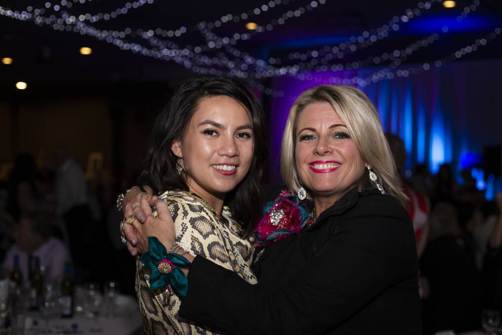 Sisters in arms: Malia Emberson-Lafoa'i with Lauren O'Brien, of The D Majors, at the Pink Meets Teal black tie fundraiser inspired by Jill Emberson's advocacy for ovarian cancer. Picture: Shane Williams of Fivespice Creative