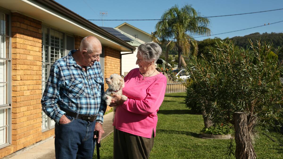Home: Maureen and Ron Mansfield with dog, Abby. John Hunter Hospital staff gave Ron a round of applause when he was discharged to go home. Picture: Simone De Peak