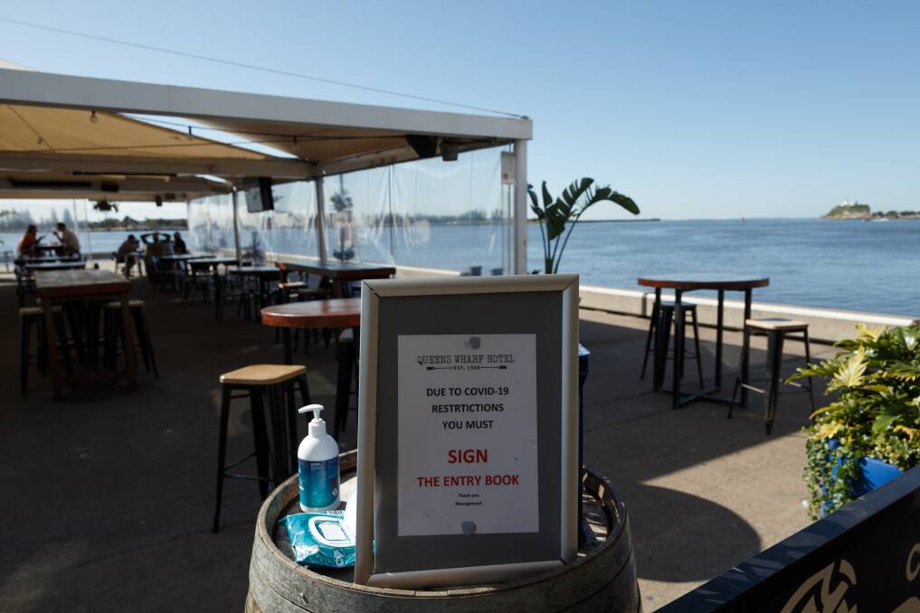 Sign in: Queens Wharf Hotel closed for cleaning after a COVID case was confirmed to have visited the pub briefly recently. Picture: Max Mason-Hubers