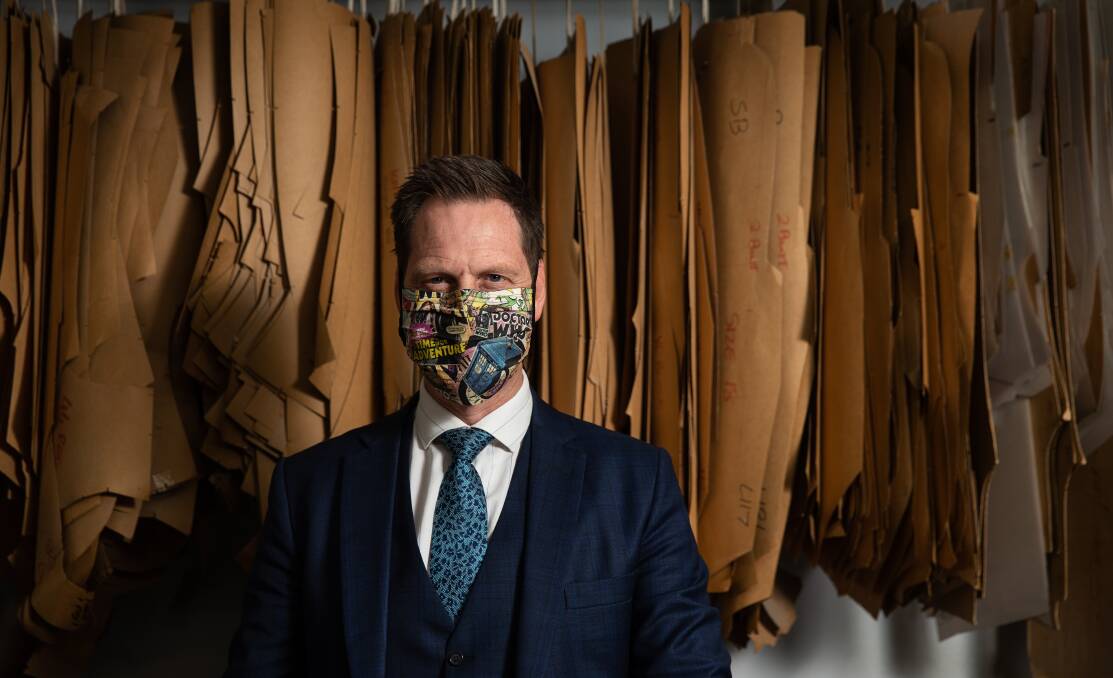 Mask man: Andrew Rundle models one of Rundle Tailoring's reversible cloth masks. Picture: Marina Neil