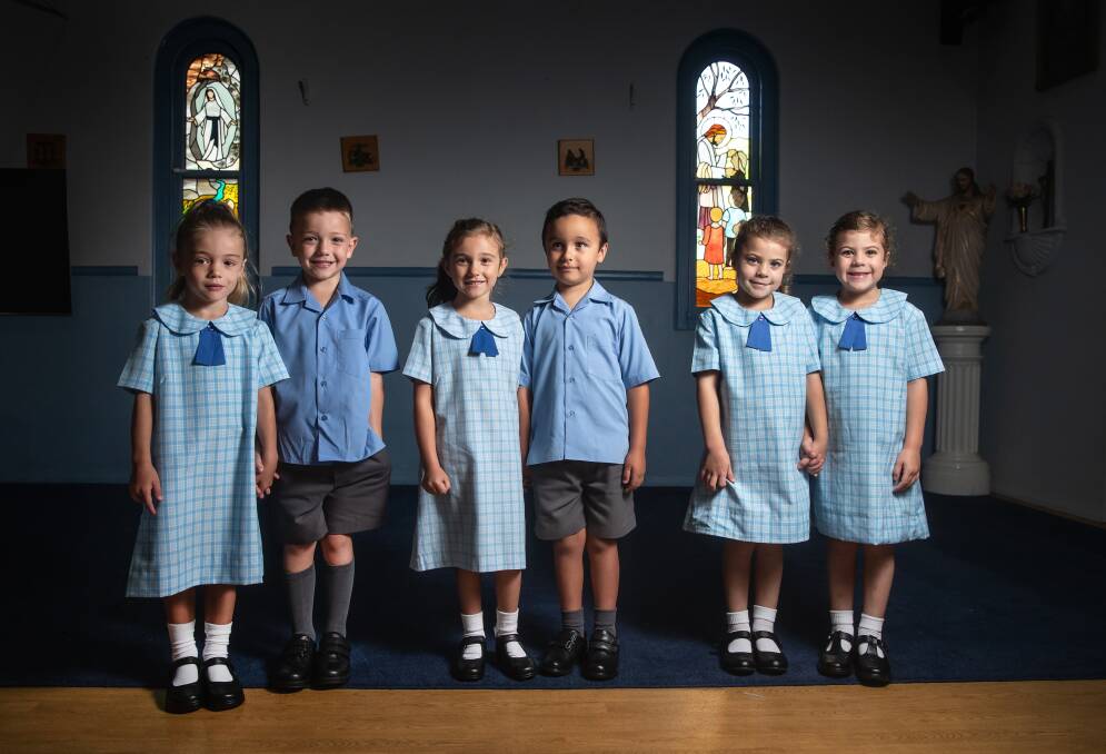 Twinning: Three sets of twins are starting kindergarten at Our Lady of Lourdes Primary School in Tarro on Tuesday. Pictured from left to right, Willow and Nate, 6; Charlotte and Luca, 5; and identical twins Charlotte and Audrey, 5. Picture: Marina Neil
