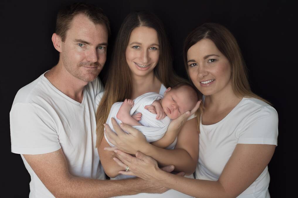 The ultimate gift: Craig, Kristy and Henry Darken, with their surrogate, Rebecca Crisp, pictured centre. They will be eternally grateful. Picture: Kelsey Mlekus Photography