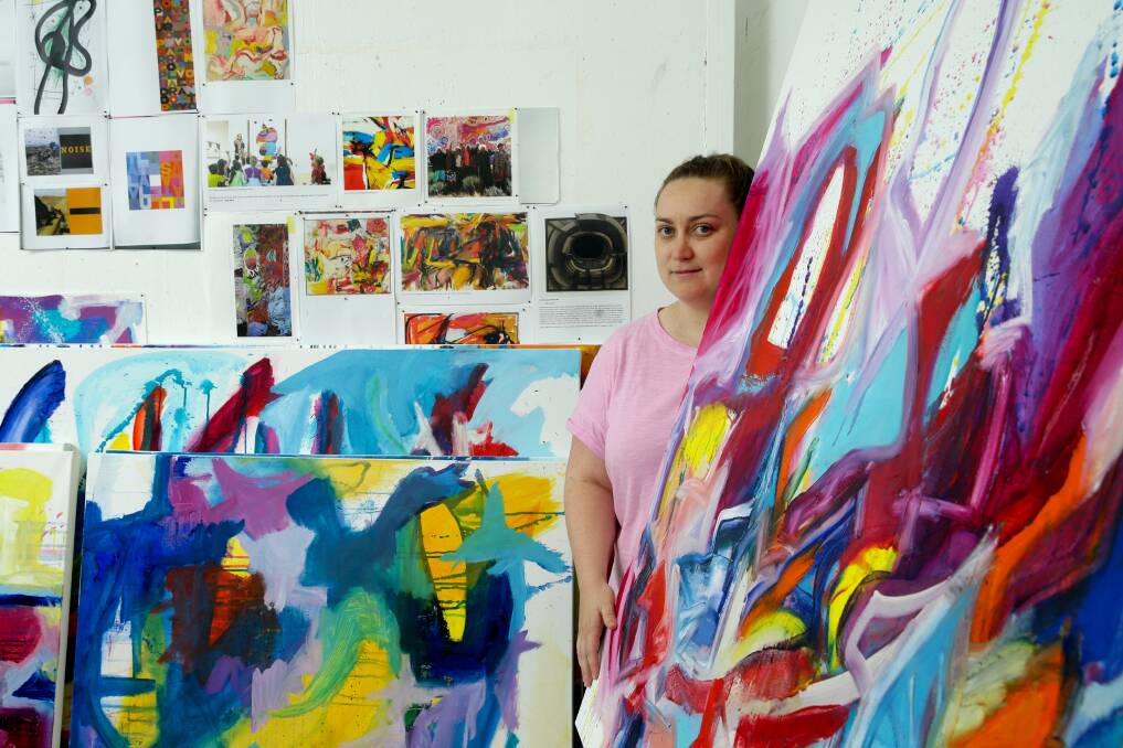 Autism and art: Honours student Jess Kellar with her paintings for her exhibition - Thinking in Pictures. Picture: Jonathan Carroll