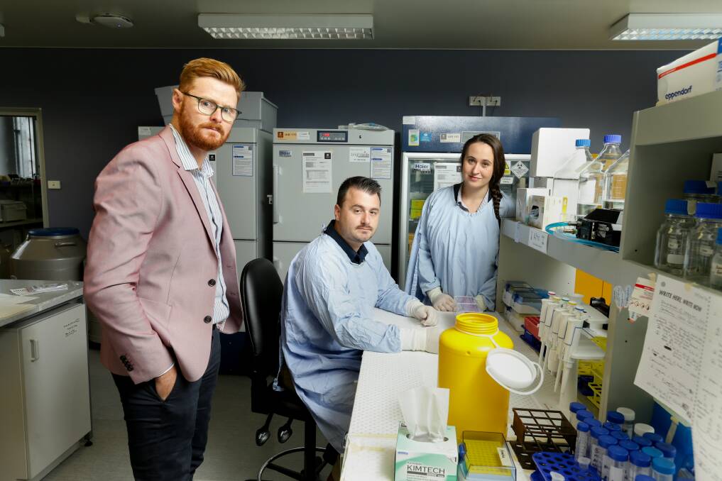 Better together: Researchers Dr Matt Dun, Ryan Duchatel and Evie Jackson are studying treatments for DIPG. Picture: Jonathan Carroll