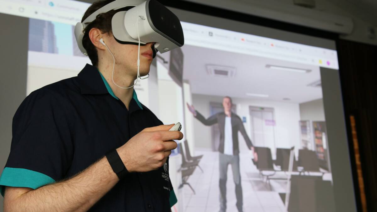 Unreal: Nursing student Damian Moore faces 'Angry Stan' in a virtual reality simulation designed to train University of Newcastle nurses in conflict resolution.