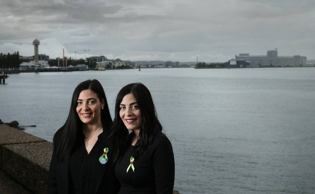 Cancer warriors: Identical twin sisters, Emily and Christina Taylor, ahead of Dry July in 2018. Emily wanted to raise money for the Calvary Mater Newcastle oncology ward, where Christina would later undergo chemotherapy for bowel cancer. Picture: Marina Neil