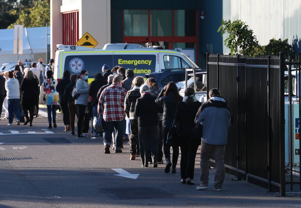 Roll up, roll up: People lining up outside the new mass vaccination hub at Belmont on Monday. Picture: Simone De Peak