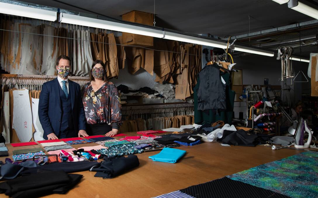Suit up: Andrew and Bronwyn Rundle, of Rundle Tailoring, diversified their business to make reusable cloth masks during the pandemic. They have tripled their factory hours to meet growing demand. Picture: Marina Neil