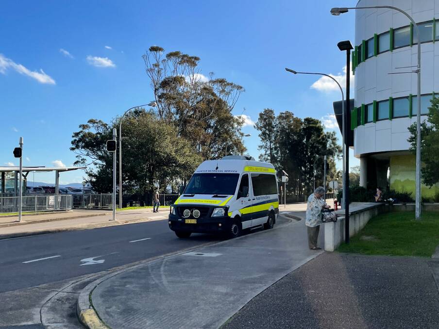 Overflow: Picture shows a Critical Care Patient Transport vehicle parked in a turning lane, as ambulances bank up at the John Hunter Hospital. Picture: Jonathan Carroll