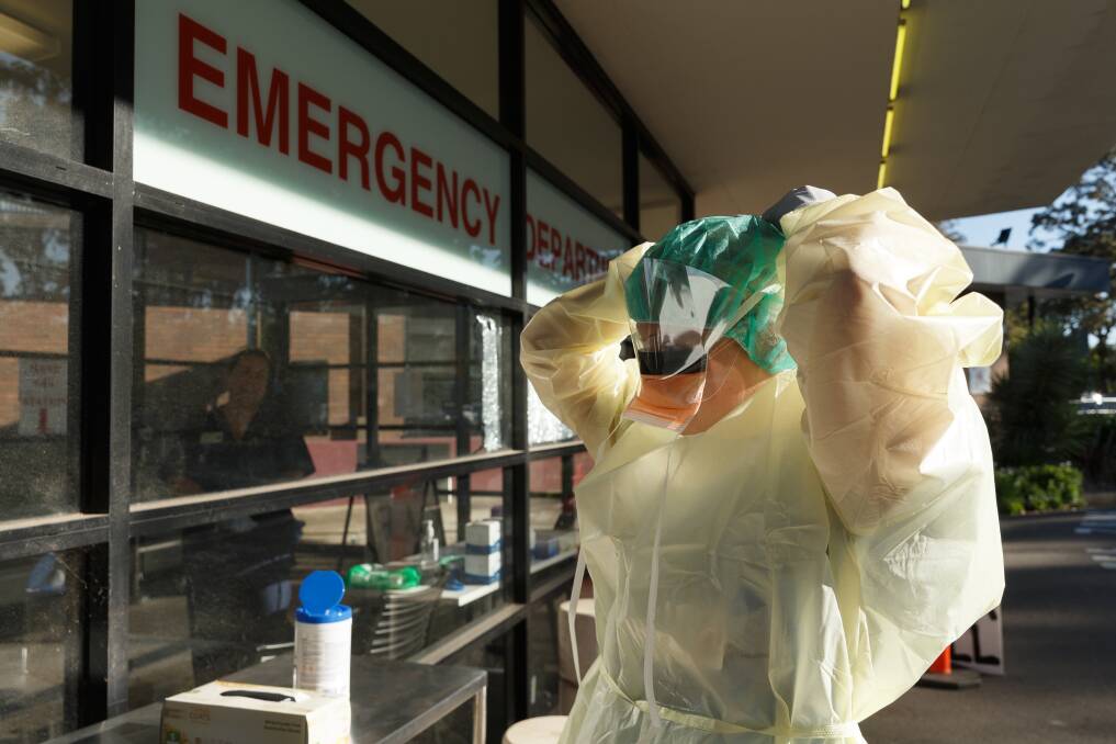 Ready: A screening clinic worker gears up ahead of COVID-19 testing at Belmont Hospital. Picture: Max Mason-Hubers