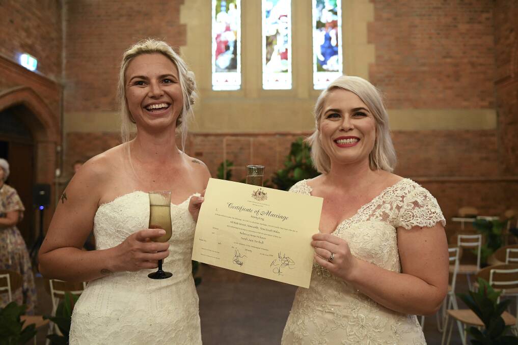 Done deal: Sarah Turnbull and Rebecca Hickson got married, officially, in front of family and friends at an intimate ceremony at 48 Watt Street, Newcastle, at 8am on Tuesday. They were one of three same sex couples to tie the knot at the venue that day. 