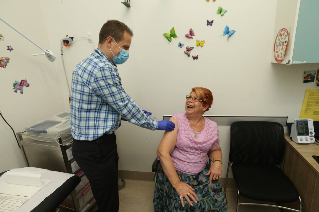 All done: Dr Ben Seckold, of Hamilton Doctors, administers the AstraZeneca vaccine to 77-year-old patient Elaine Wellings on Tuesday. The practice received a small supply of doses on Monday. Picture: Jonathan Carroll