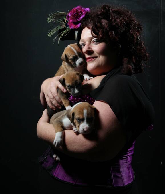 RESCUE: Belinda Roals, co-owner of Kavon Theme Restaurant, with some of her foster puppies. She ran "Furlesque" to raise money. Picture: Max Mason-Hubers.