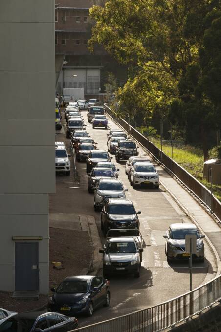 Jammed: Traffic backs up as staff, patients and visitors try to leave the internal road network at John Hunter Hospital on Wednesday afternoon. Picture: Max Mason-Hubers.
