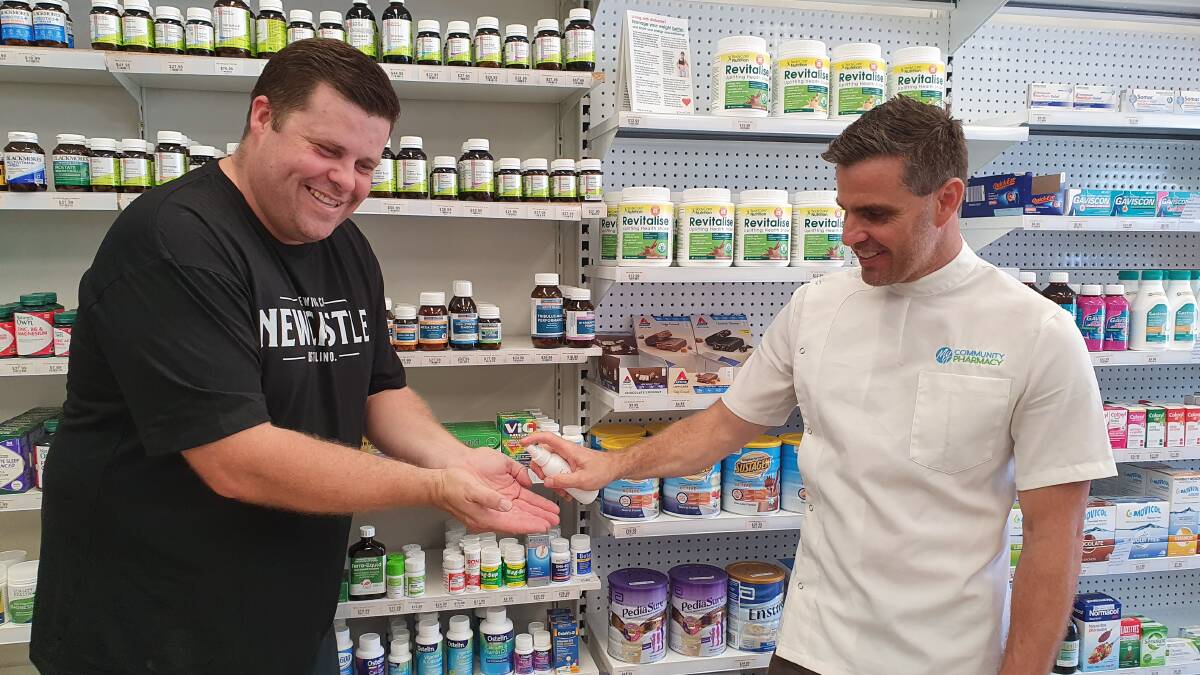 Help: From left Lucas Catell, of Newcastle Distilling Co, and John Jones, from Shortland's My Community Pharmacy, have teamed up to make hand sanitiser.