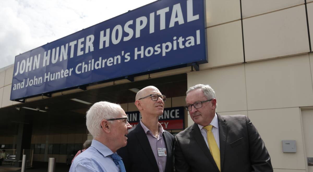 Wish list: Co-chair of the John Hunter Hospital's Medical Staff Council, Dr Stephen Oakley, is pictured centre, with Dr Michael Boyle and Health Minister Brad Hazzard at the local redevelopment announcement in March. Picture: Simone De Peak