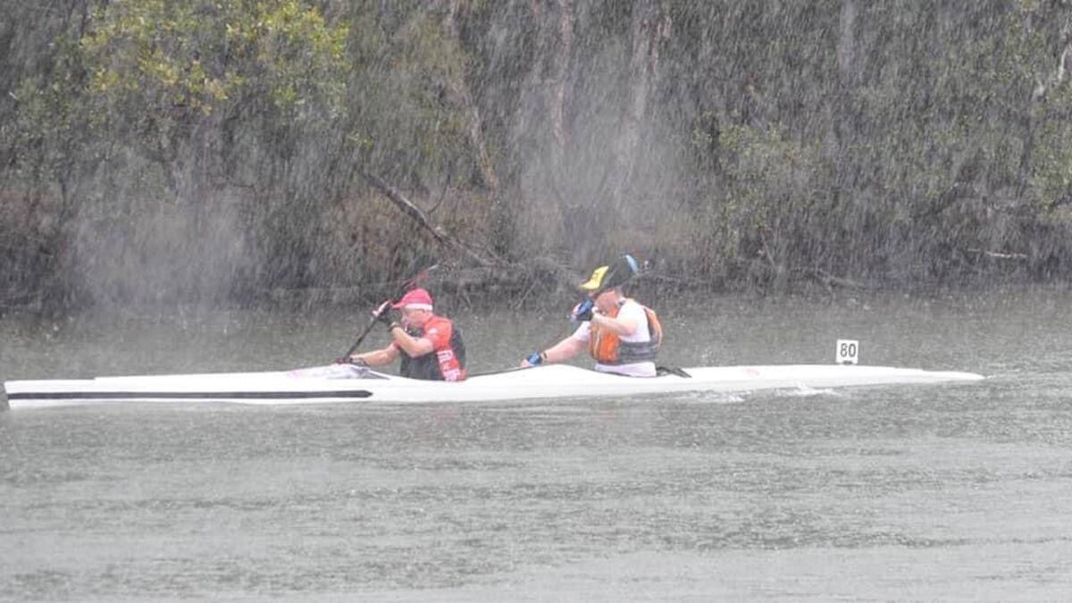 Back in the boat: Russell Brown, Matthew's father, braved the rain with Ross Ferguson to paddle in a kayak race and raise awareness of DonateLife Week.
