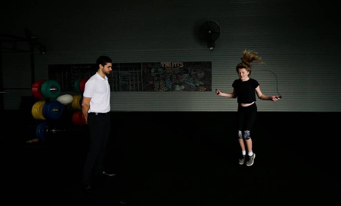 Skipping through it: Lizzie Walters, 13, has had positive results doing interval training with Ryan McCathie. Picture: Jonathan Carroll.