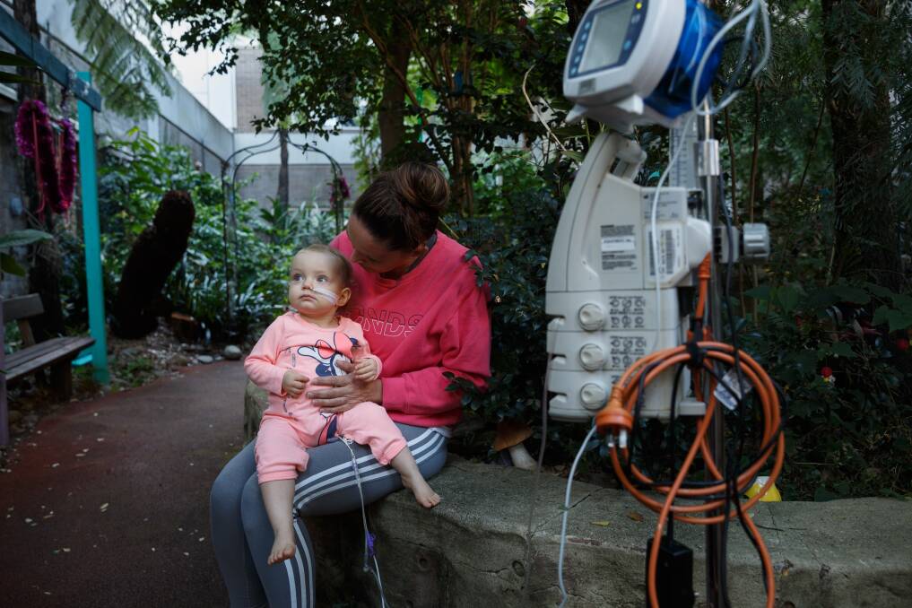 Nightmare: Emma Downie, of Cameron Park, spends time with her one-year-old daughter, Zaylee, ahead of the toddlers second round of chemotherapy. Picture: Max Mason-Hubers