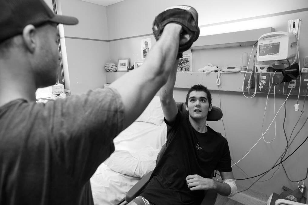 Road to recovery: Lawson Rankin does a boxing exercise with his brother Nelson in his room at Rankin Park Centre. Picture: Max Mason-Hubers