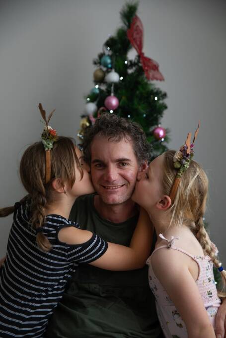 Daddy's home: Chris Apps with his daughters, Ruby and Peppa, back at home after a mountain bike accident left him with "incomplete quadriplegia".