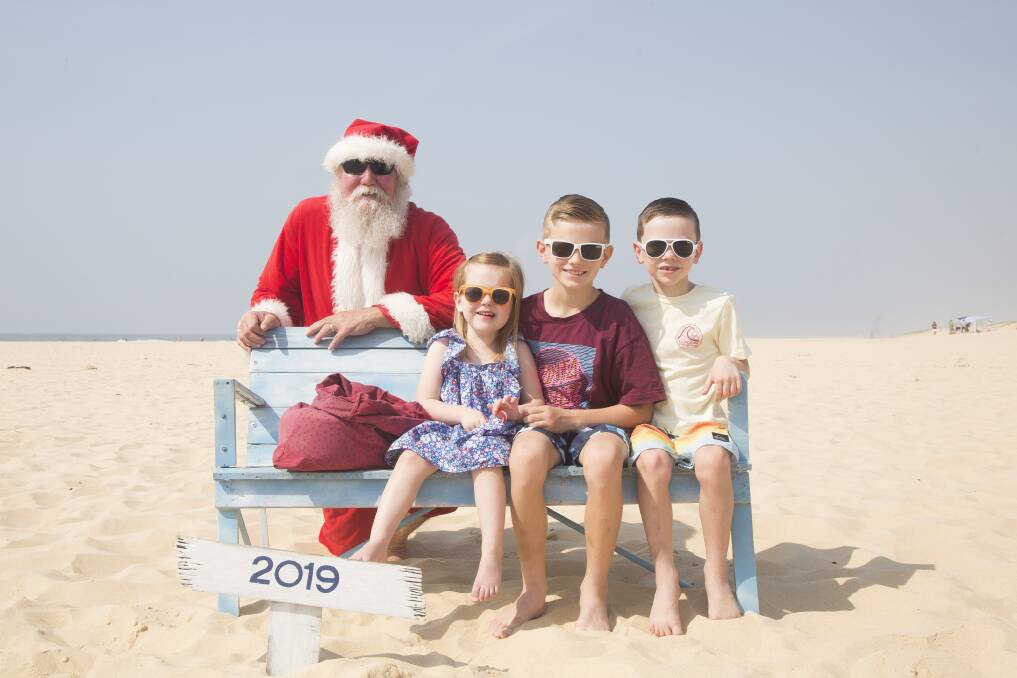 Last Christmas: Victoria Binnie with her brothers, Harrison and Alexander. Victoria had loved Christmas. Picture: Photos With Sandy Claus