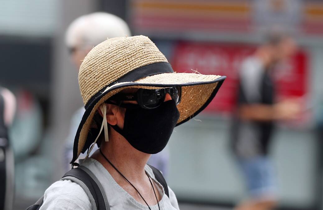 People in some areas are back to wearing masks. Picture: Robert Peet