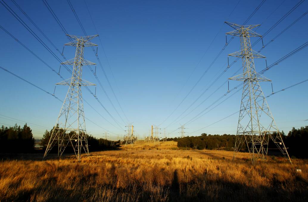 High voltage: High voltage transmission lines running from Liddell Power Station. The grid reliability fund will underwrite the integration of renewable energy and grid stabilisation technologies. Picture: Max Mason-Hubers