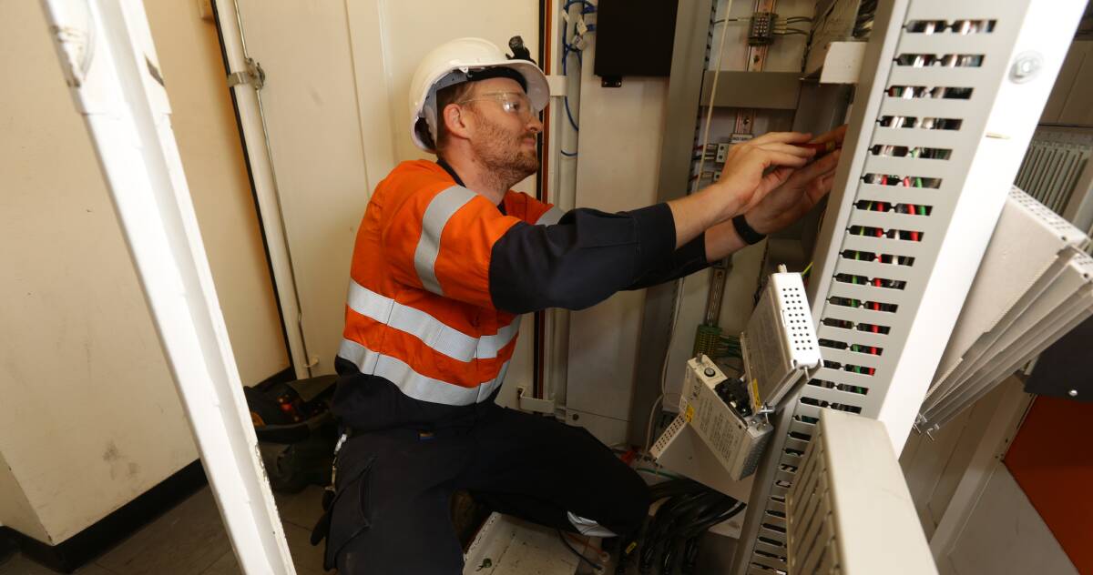 Loves his job: Technician Pete Granger at work at Eraring Power Station. Picture: Jonathan Carroll.