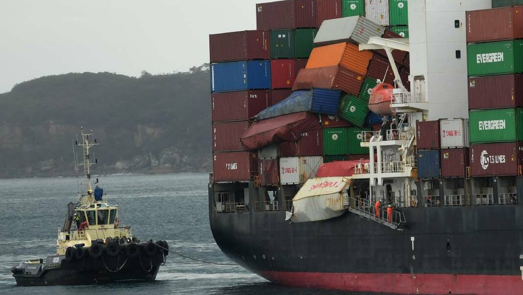 Unfolding disaster: Cargo containers falling from the YM Efficiency in June 2018. The federal government has sent the ship's owners a bill for cost of the clean-up.