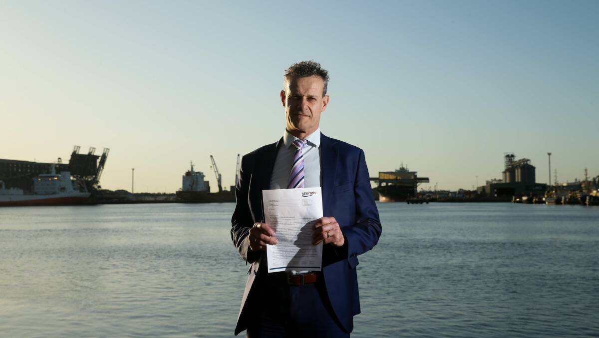 Unimpressed: Newcastle MP Tim Crakanthorp with a copy the NSW Ports letter that argues that a container terminal should not be built in Newcastle. Picture: Jonathan Carroll.