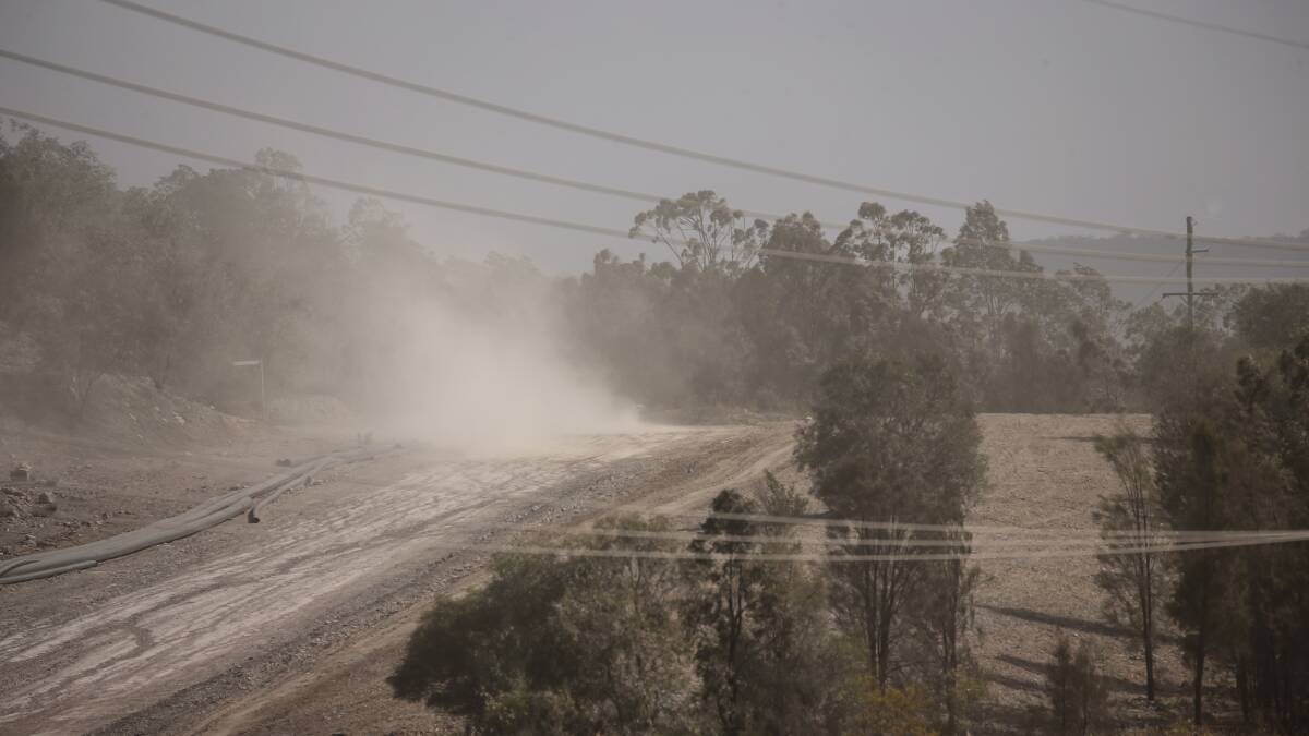 Nothing to see here: Dust blowing off a Hunter mine site last Friday afternoon. There has been an unprecedented number of alerts for poor air quality this year. Picture: Marina Neil