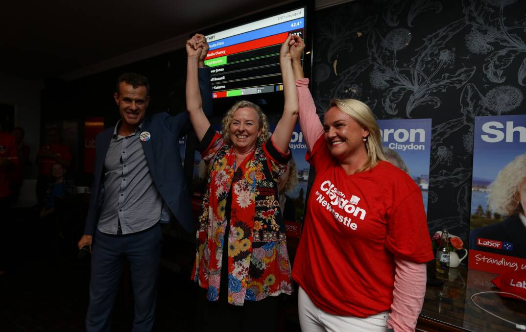 Victory: State member for Newcastle Tim Crakanthorp and Newcastle Lord Mayor Nuatali Nelmes congratulate Sharon Claydon on her win at the Sunnyside Tavern on Saturday night. Picture: Jonathan Carroll