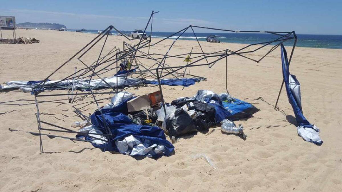 Surf, sand and slobs – car parts, camping gear, broken bottles among trash left on beach